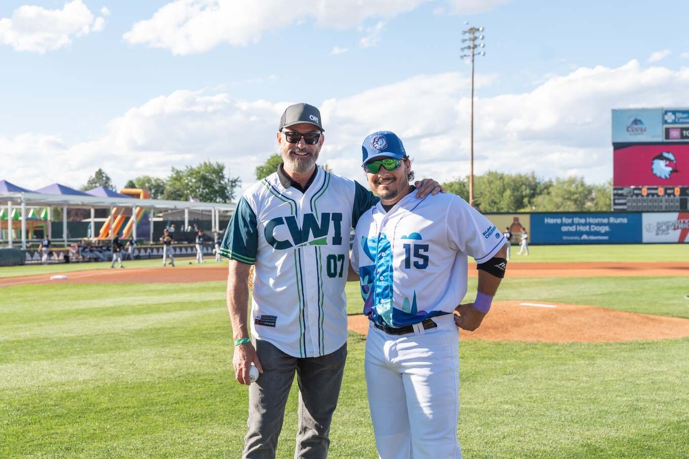Mike Peña in a CWI jersey at a Boise Hawks game